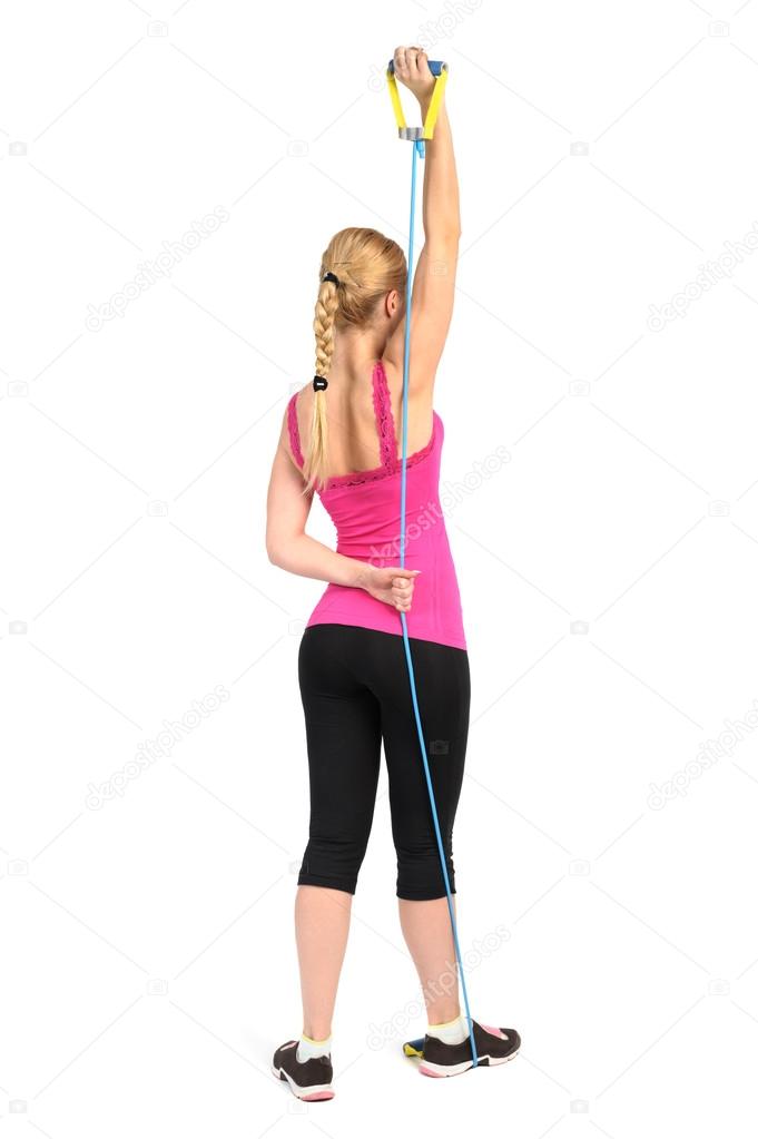 Female triceps extension exercise using rubber resistance band — Stock