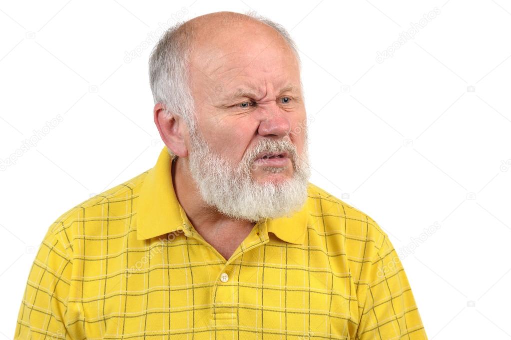 Disgusted senior bald man