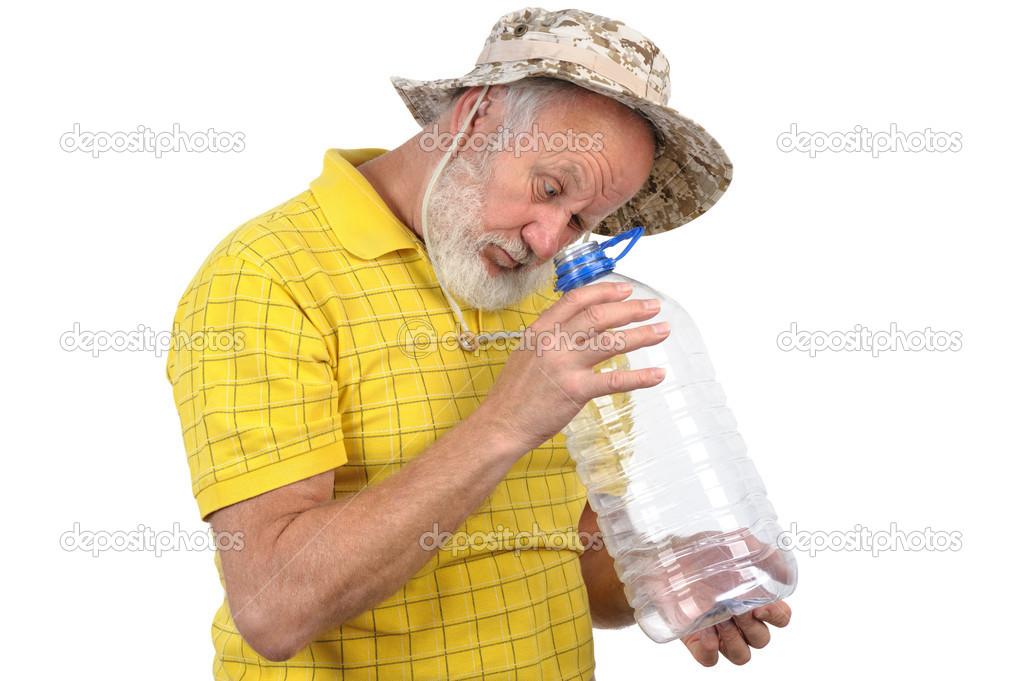 senior man looking into empty bottle
