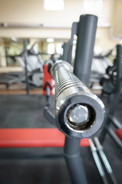 Empty barbell bar waiting to workout — Stock Photo, Image