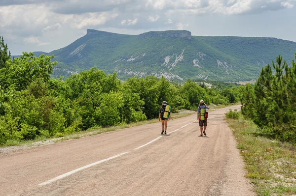 Two hiking people on the road — Stock Photo, Image