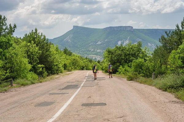 Two hiking people on the road — Stock Photo, Image
