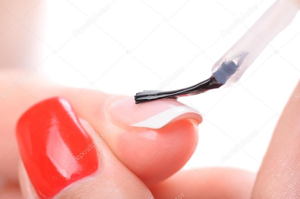manicure, applying clear enamel
