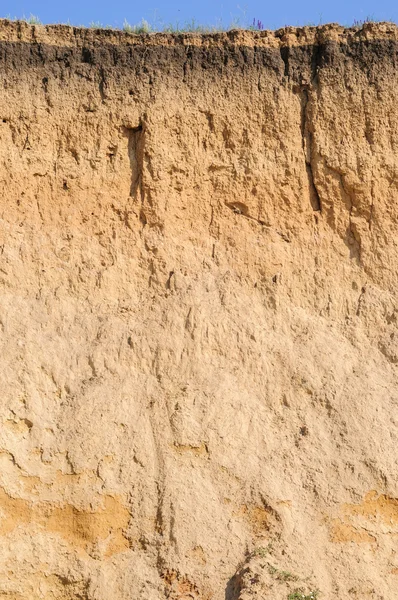 Cut of soil with different layers, grass and sky — Stock Photo, Image