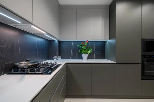 Luxury grey, white and blue kitchen details at the worktop corner