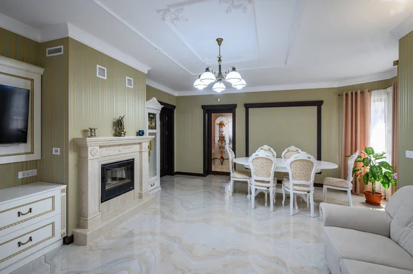Classic living room interior design. Spacious room, luxury marble floor, elegant chairs and even fireplace