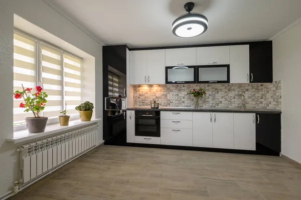 Interior renovation showcase of well designed modern trendy white kitchen