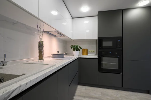 Showcase interior of modern simple trendy dark grey and white kitchen