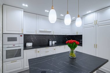 Luxury large modern domestic kitchen furniture with island and black marble worktop