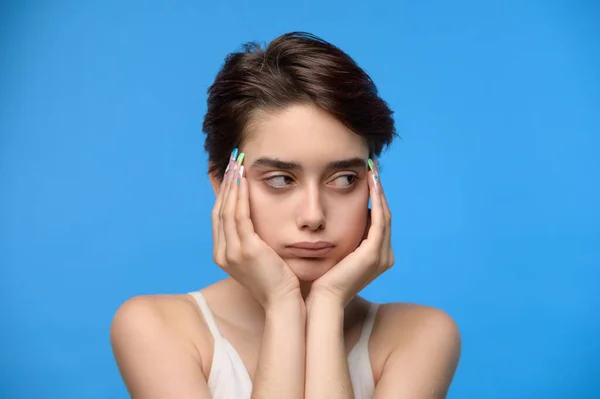 Depressed Pouting Sensual Young Teenage Girl Looking Sideways Blue Background — Stockfoto