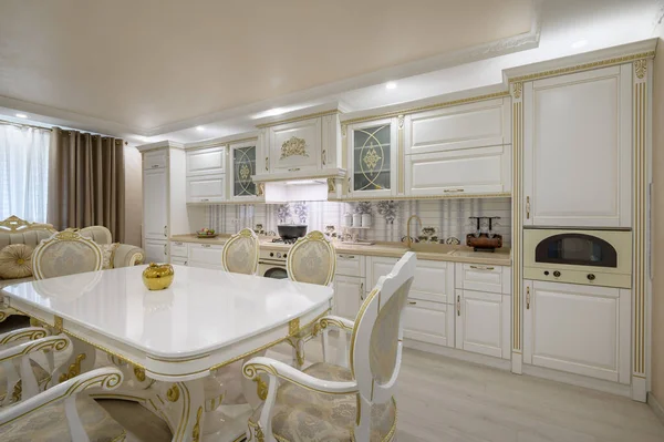 Interior renovation showcase of rich classic white kitchen