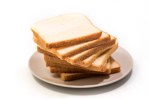 Στοίβα Από Φέτες Ψωμιού Φρυγανίσματος Ένα Πιάτο Που Απομονώνεται Λευκό — Φωτογραφία Αρχείου
