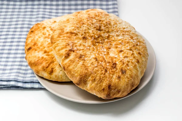 Loafs Flat Wheat Bread Plate Blue Kitchen Cloth White Table — Stock Photo, Image