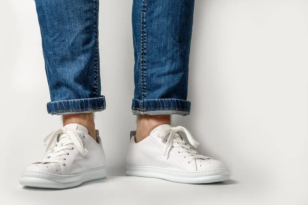 Man Stylis New White Sneakers Jeans White Background Horizontal Image — Fotografia de Stock