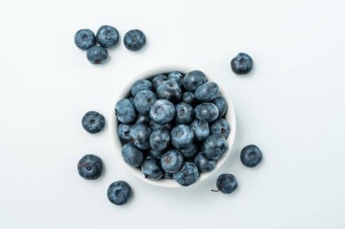Bowl of fresh Blueberries isolated on white background. Top View