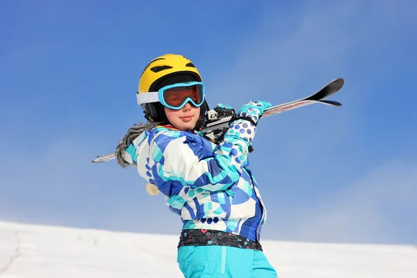 Girl with ski on the shoulder — Stock Photo, Image