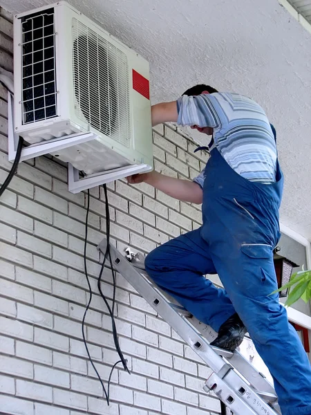 Air conditioning worker Stock Photo