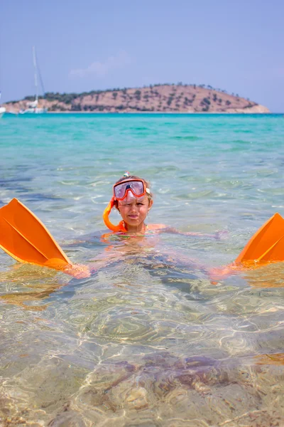 Girl with flippers in the sea — Stock Photo, Image