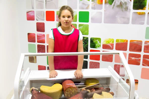 Girl shop assistant — Stock Photo, Image