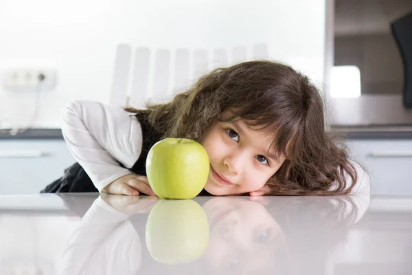 Girl and green apple — Stock Photo, Image