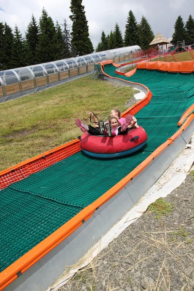 Girls on the slide — Stock Photo, Image