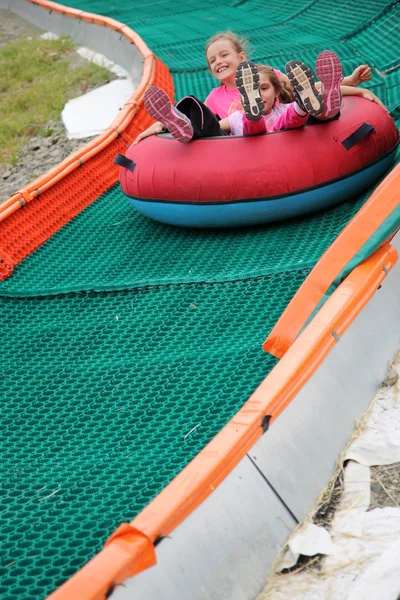 Girls on the slide — Stock Photo, Image