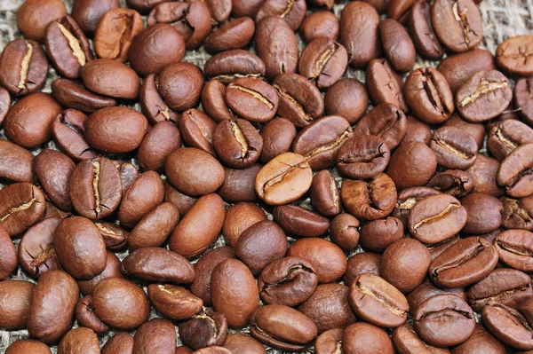 Coffee beans on sacking — Stock Photo, Image