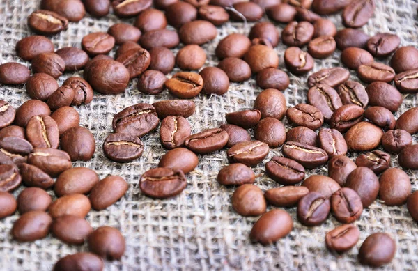 Coffee beans on sacking — Stock Photo, Image