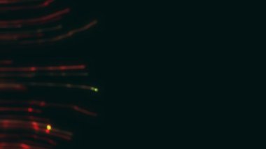 Soyut Dönen Işık İplikleri Parçacıkları Arkaplan Döngüsü / 4k Soyut bir teknolojinin canlandırması Güçlü girdap hızı neon çok renkli parçacıklar desenleri ve dikişsiz döngüler