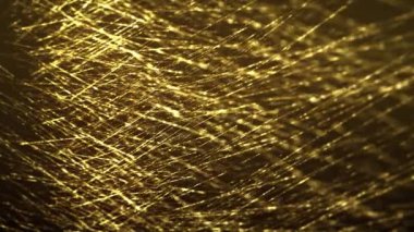 Abstract Gold Filaments Bursting Background/ 4k animation of an abstract wallpaper background of bursting gold filaments lines and particles sparkling with glimmer fx and depth of field