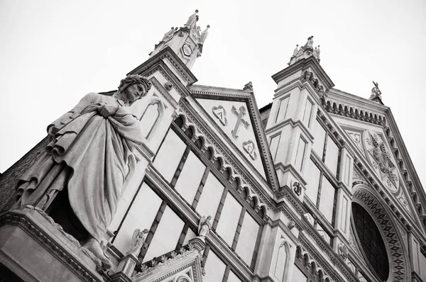 The famous poet Dante Alighieri 's statue in Piazza Santa Croce in Florence, Italy — стоковое фото