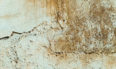 Grunge brown old stone background, cracked texture.