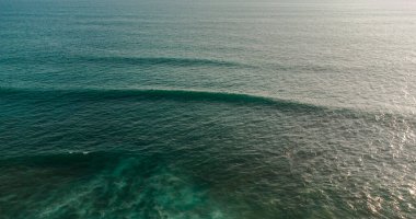 aerial drone view of the beach with wave on the sea coast of the island.
