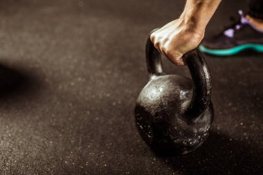 Fitness concept with kettlebell, dumbbells. sport background on the gym, strength training.