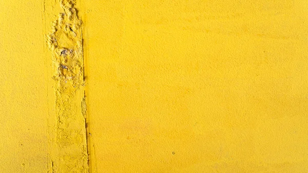 Yellow background, damaged wall, energetic colors, summer texture.