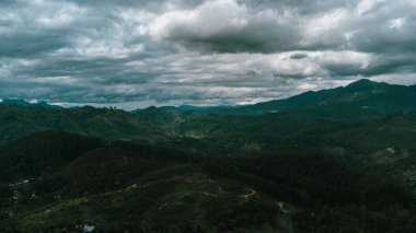 Beautiful mountain landscape with green mountains and blue sky.