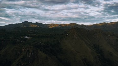 Beautiful mountain landscape with green mountains and blue sky.