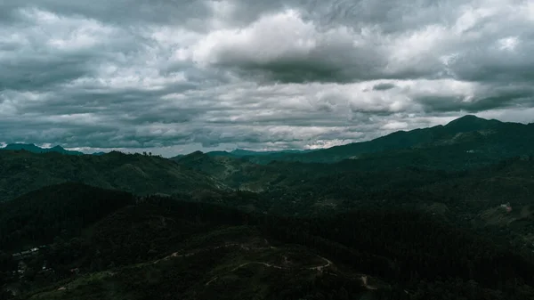 Beautiful mountain landscape with green mountains and blue sky.