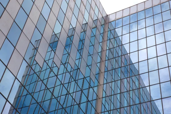 Modern facade of glass and steel with reflections — Stock Photo, Image