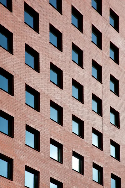 Brick office with many blue windows — Stock Photo, Image