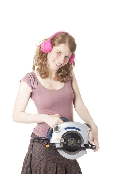 Young pretty woman with circular saw — Stock Photo, Image