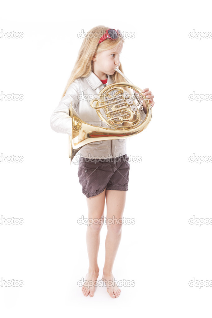 young girl playing french horn