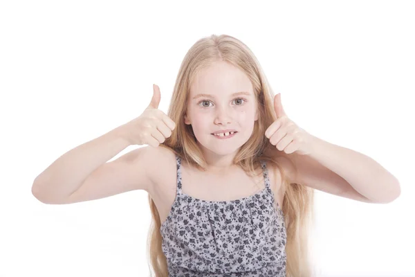 Young girl in studio with both thumbs up — Stock Photo, Image