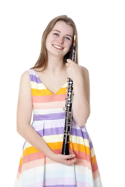 Chica sonriente en vestido colorido con oboe — Foto de Stock