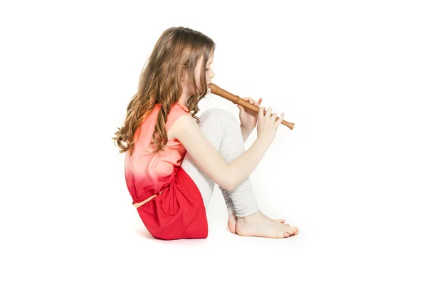 Young girl sitting with soprano recorder — Stock Photo, Image