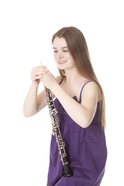 Menina com oboé contra fundo branco — Fotografia de Stock