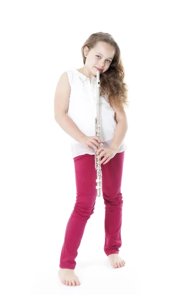 Joven chica sosteniendo flauta de pie — Foto de Stock