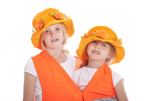 Két lány narancssárga ruhában — Stock Fotó