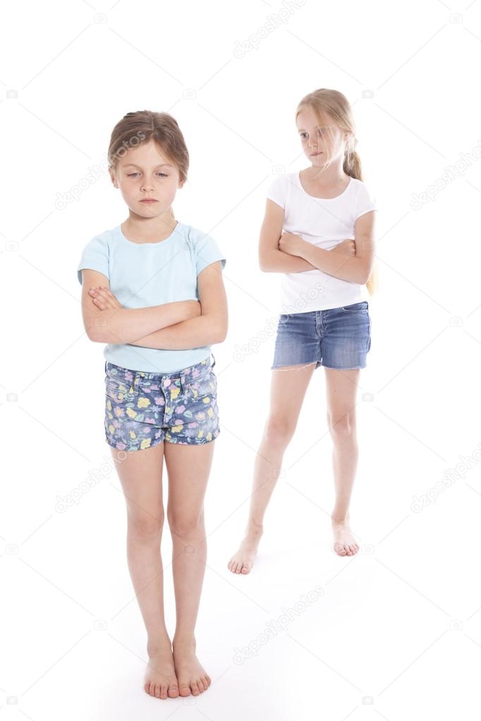 Two young girls having a disagreement