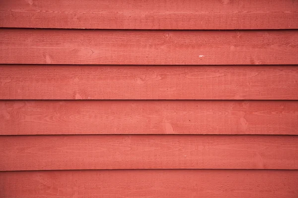 Fence with horizontal red painted planks — Stock Photo, Image